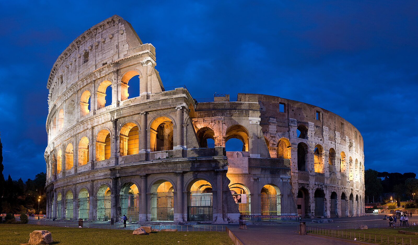 The Colosseum at dusk in Rome, Italy - iconic ancient Roman amphitheater panorama