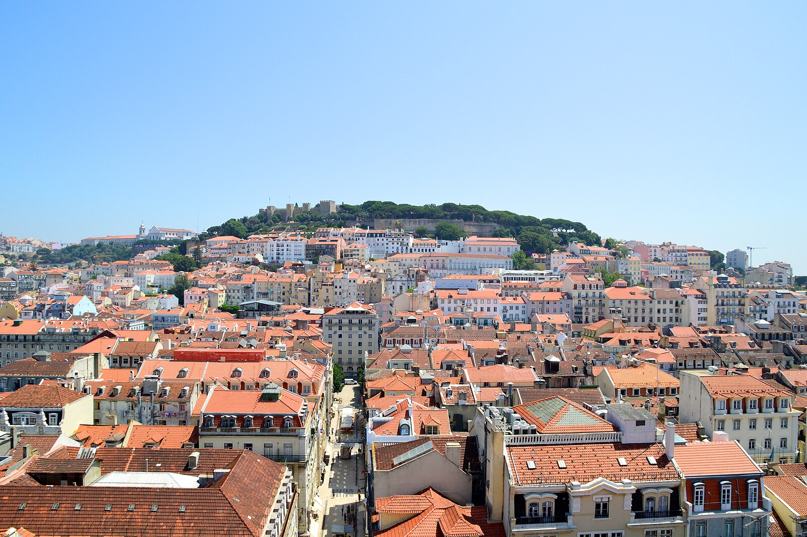 Lisbon Baixa district and Sao Jorge Castle overlooking the Tagus river, Portugal